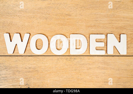 wooden word made from wooden letters on an old table Stock Photo