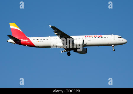 MADRID / SPAIN - MAY 2, 2016: Iberia Airlines Airbus A321 EC-JLI passenger plane landing at Madrid Barajas Airport Stock Photo