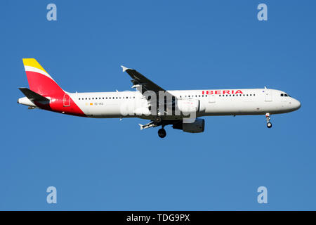 MADRID / SPAIN - MAY 2, 2016: Iberia Airlines Airbus A321 EC-IXD passenger plane landing at Madrid Barajas Airport Stock Photo