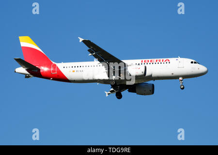 MADRID / SPAIN - MAY 2, 2016: Iberia Airlines Airbus A320 EC-ILS passenger plane landing at Madrid Barajas Airport Stock Photo