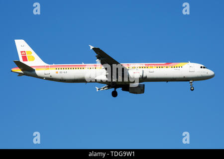 MADRID / SPAIN - MAY 2, 2016: Iberia Airlines Airbus A321 EC-ILO passenger plane landing at Madrid Barajas Airport Stock Photo