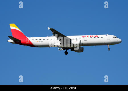 MADRID / SPAIN - MAY 2, 2016: Iberia Airlines Airbus A321 EC-HUI passenger plane landing at Madrid Barajas Airport Stock Photo