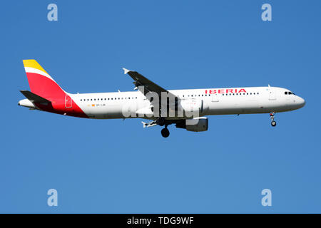 MADRID / SPAIN - MAY 2, 2016: Iberia Airlines Airbus A321 EC-IJN passenger plane landing at Madrid Barajas Airport Stock Photo