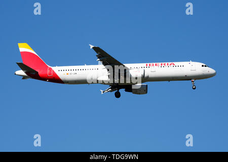 MADRID / SPAIN - MAY 2, 2016: Iberia Airlines Airbus A321 EC-JZM passenger plane landing at Madrid Barajas Airport Stock Photo