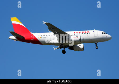 MADRID / SPAIN - MAY 2, 2016: Iberia Airlines Airbus A319 EC-KOY passenger plane landing at Madrid Barajas Airport Stock Photo