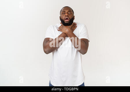 Sick African man with sore throat. Portrait of ill black man suffering from sore throat due to cold. Stock Photo