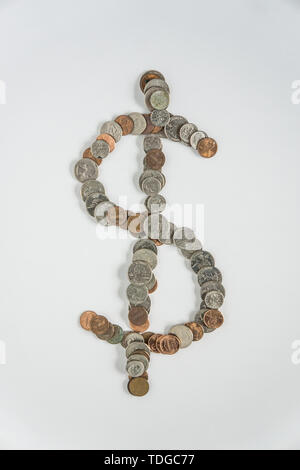 Dollar symbol of US American currency money coins in change - wealth economy / power status showing finance concept on blank white background with emp Stock Photo