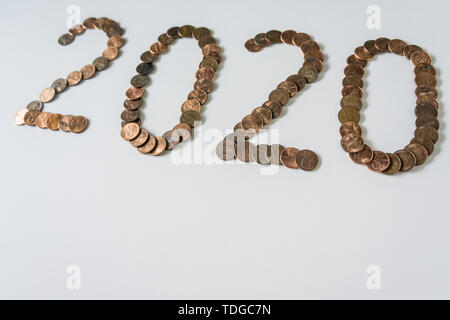 2020 Year made of isolated bronze penny coins on blank white background w/ empty room space for text, copy, or copyspace. Tomorrow is the next future  Stock Photo