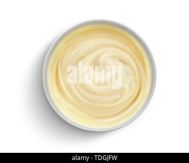Bowl of condensed milk isolated on white background, top view Stock Photo