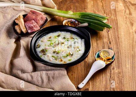 Leather egg lean meat porridge porridge breakfast wooden table food photography picture Stock Photo