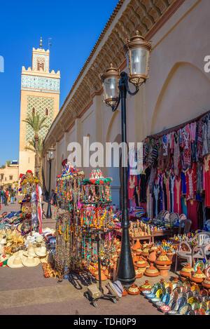Koutoubia Mosque with many souvenirs for sale at the Medina quarter of Marrakech Stock Photo