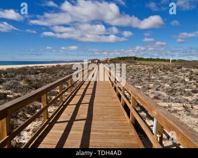 Typical wooden foot path leading from Vilamoura to Albufeira along the beach in Portugal Stock Photo