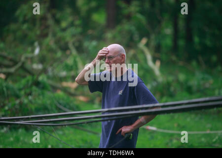 Ellettsville, USA. 15th June, 2019. A man reacts after a tornado touched down around the 6400 block of West Cowden Rd. near Ellettsville. The tornado destroyed several homes, tore up trees, and left dangerous live power lines scattered around the area. Credit: SOPA Images Limited/Ģ����ý Live News Stock Photo