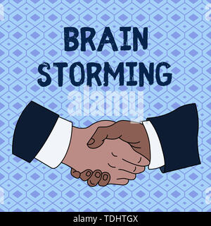 Handwriting text Brain Storming. Conceptual photo Stimulating creative thinking Developing new ideas Discussion Hand Shake Multiracial Male Business P Stock Photo