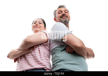 Proud smiling man and woman couple with arms crossed portrait from below isolated on white background Stock Photo