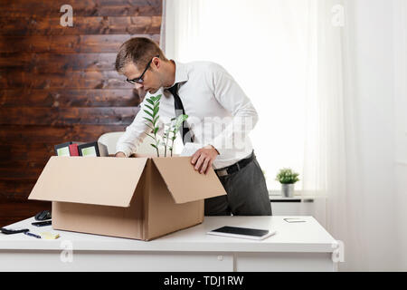 Successful businessman moving into a new office Stock Photo