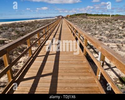 Typical wooden foot path leading from Vilamoura to Albufeira along the beach in Portugal Stock Photo