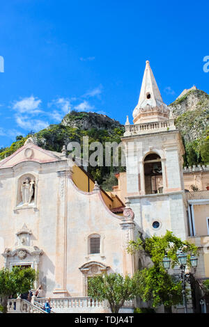 Taormina, Sicily, Italy - Apr 8th 2019: Vertical picture of San Giuseppe Church on Piazza IX Aprile square in the old town. Baroque religious building, famous tourist spot. Blue sky, sunny. Stock Photo