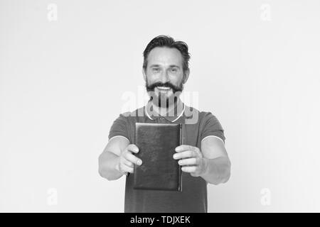 Literary critic. Man mature bearded guy hold book. Satisfied reader. Book presentation concept. Author presenting book copy space. Bestseller and book store. Literature taste and recommendations. Stock Photo