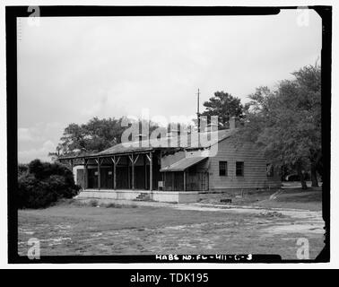 OBLIQUE VIEW OF THE WEST (REAR) AND SOUTH FACADES, LOOKING NORTHEAST - Eglin Air Force Base, Motor Repair Shop, Northwest of Flager Road, Chisk Lane and southern edge of Weekly Bayou, Valparaiso, Okaloosa County, FL Stock Photo