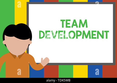 Writing note showing Team Development. Business concept for learn why and how small groups change over time with graphs Young man standing in front wh Stock Photo