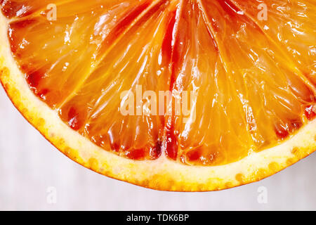 Close up macro of fresh organic Sicilian blood oranges sliced. Stock Photo