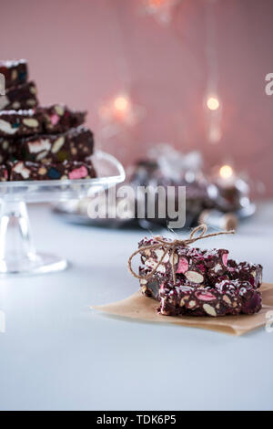 Chocolate brownies with marshmallows, hand wrapped in string. Stock Photo