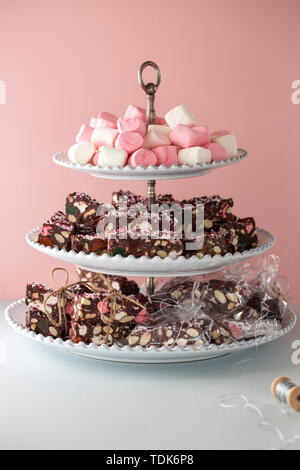 Chocolate brownies with marshmallows, hand wrapped in string. Stock Photo