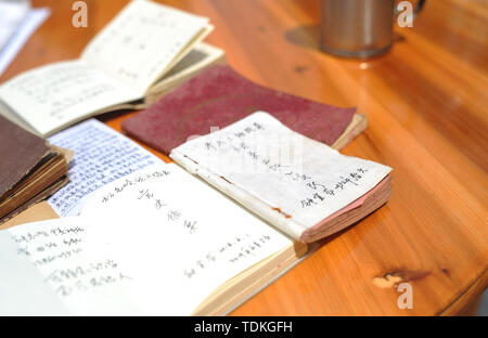 Changting. 16th June, 2019. Photo taken on June 16, 2019 shows the notebooks of Zhong Yilong, a 91-year-old retired cadre, at the Changketou Village of Nanshan Town in Changting County, southeast China's Fujian Province. Since 1953, Zhong Yilong collected the names of martyrs who participated in revolution from 1928 to 1934. He also set up an exhibition regarding the Red Army at his ancestral house several years ago to pass the history down. Credit: Li Renzi/Xinhua/Alamy Live News Stock Photo