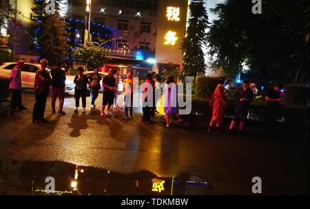 Yibin, China's Sichuan Province. 17th June, 2019. People gather outside after an earthquake in Changning County of Yibin City, southwest China's Sichuan Province, June 17, 2019. A 6.0-magnitude earthquake rattled Changning County at 10:55 p.m. Monday (Beijing Time), according to the China Earthquake Networks Center (CENC). The epicenter, with a depth of 16 km, was monitored at 28.34 degrees north latitude and 104.90 degrees east longitude, the CENC said in a formal report. Credit: Hou Li/Xinhua/Alamy Live News Stock Photo
