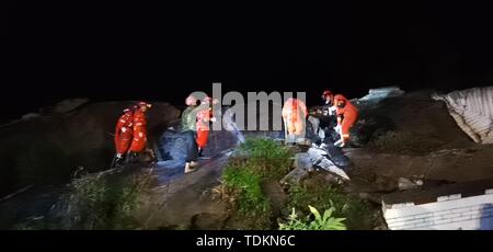 Yibin, China's Sichuan Province. 18th June, 2019. Rescuers search for trapped people at Shuanghe Town in Changning County of Yibin City, southwest China's Sichuan Province, June 18, 2019. A 6.0-magnitude earthquake rattled Changning County at 10:55 p.m. Monday (Beijing Time), according to the China Earthquake Networks Center (CENC). Credit: Chen Rui/Xinhua/Alamy Live News Stock Photo