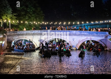 Cambridge UK 17th June 2019. A chaotic almost medieval scene on the Backs and the River Cam at the Trinity College May Ball as people in punts and boats leave after a firework display had ended. Various Cambridge University Colleges hold the traditional balls in May Week, which is in June, with lavish entertainment, food, drink and partying as students celebrate the end of term. Credit Julian Eales/Alamy Live News Stock Photo