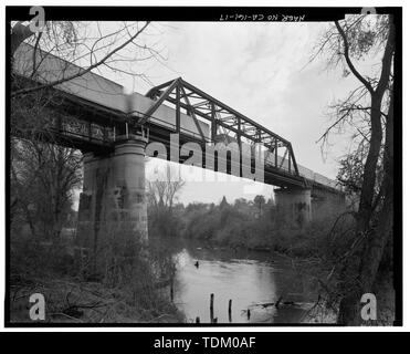 Oblique view to south-southeast of downstream (west) side of bridge, with southbound 'piggyback' train on structure. - Stanislaus River Bridge, Atchison, Topeka and Santa Fe Railway at Stanislaus River, Riverbank, Stanislaus County, CA Stock Photo