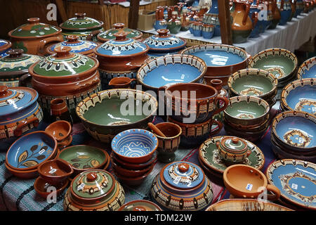 Many decorative dishes on the counter at the medieval festival in Cyprus. Ayia NAPA. Stock Photo