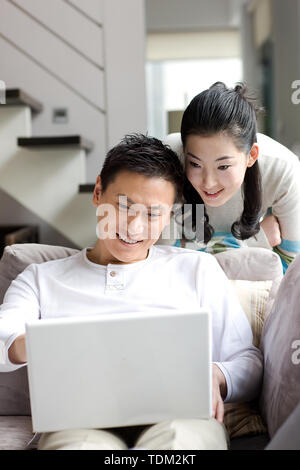 A couple using a laptop Stock Photo