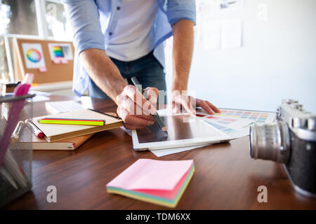 Graphic Designer working with interactive pen display, digital Drawing tablet and Pen on a computer Stock Photo