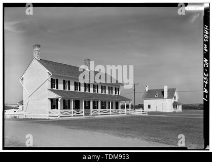 PERSPECTIVE VIEW OF SOUTHEAST (FRONT) AND SOUTHWEST SIDE, WITH PRINCIPAL KEEPER'S DWELLING IN BACKGROUND - Cape Hatteras Lighthouse, Double Keeper's Dwelling, Point of Cape Hatteras, Access Road from Route 12, Buxton, Dare County, NC Stock Photo