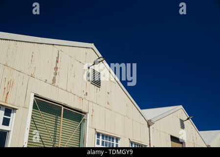 Low angle view of a corrugated iron industrial warehouse in Perth, Australia. Stock Photo