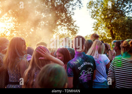 Myrhorod, Ukraine - June 16, 2019: Group of a young people throwing paints on indian Holi festival of colors Stock Photo