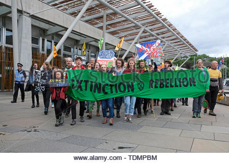 Edinburgh, Scotland, 17th June 2019. Extinction Rebellion Scotland Parade of Life, a march from Edinburgh Castle down the Royal Mile to the Holyrood Rebel Camp outside the Scottish parliament. Shown here outside the parliament. This is to highlight the carbon reduction cause and to keep the pressure on politicians, who will debate the Climate Bill on the 18th and 25th June.  Credit: Craig Brown Stock Photo