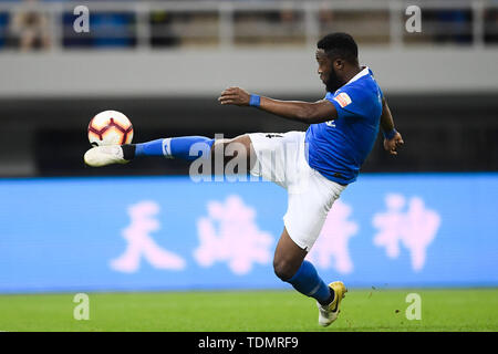 Cameroonian football player Franck Ohandza of Henan Jianye shots the ball against Tianjin Tianhai in their 13th round match during the 2019 Chinese Football Association Super League (CSL) in Tianjin, China, 16 June 2019.  Tianjin Tianhai played draw to Henan Jianye 1-1. Stock Photo