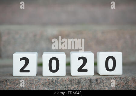 Plastic white cubes on blurred grey upstairs Stock Photo