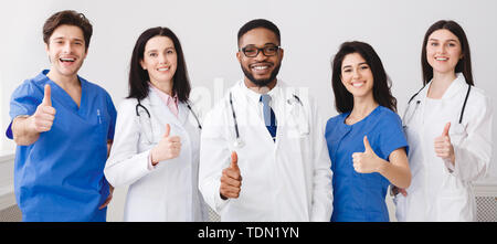 Happy Doctors And Interns Showing Thumbs Up Stock Photo