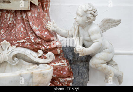 CATANIA, ITALY - APRIL 7, 2018: The angels and baroque marble stoup in Chiesa di San Nicolo. Stock Photo