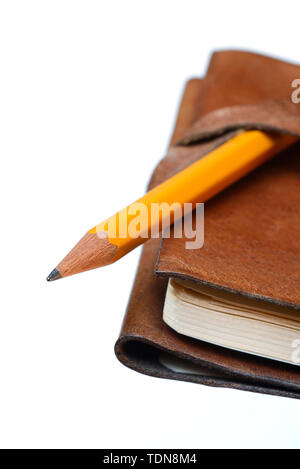 Bleistift auf Notizbuch, Tagebuch, Reisetagebuch Stock Photo