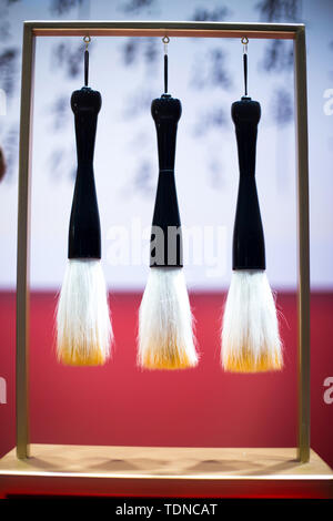 hanging calligraphy brushes on steel frame Stock Photo