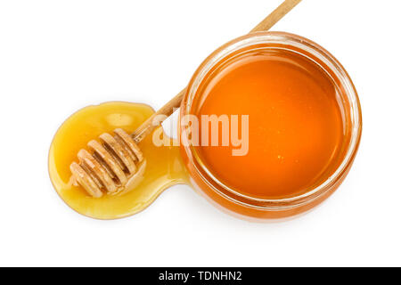 glass jar full of honey and stick isolated on white background Stock Photo