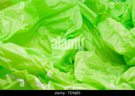 Green Plastic Bag Texture. Abstract Wrinkled Background of Plastic Garbage Stock Photo