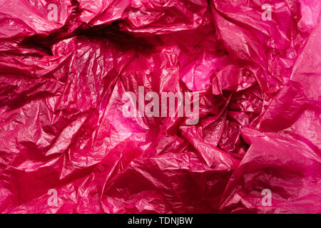 Red Plastic Bag Texture. Abstract Wrinkled Background of Plastic Garbage Stock Photo