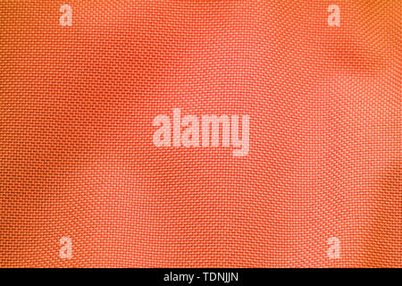 Orange Nylon Fabric Texture Background. Thick Fabric for Backpacks and Sports Equipment Stock Photo